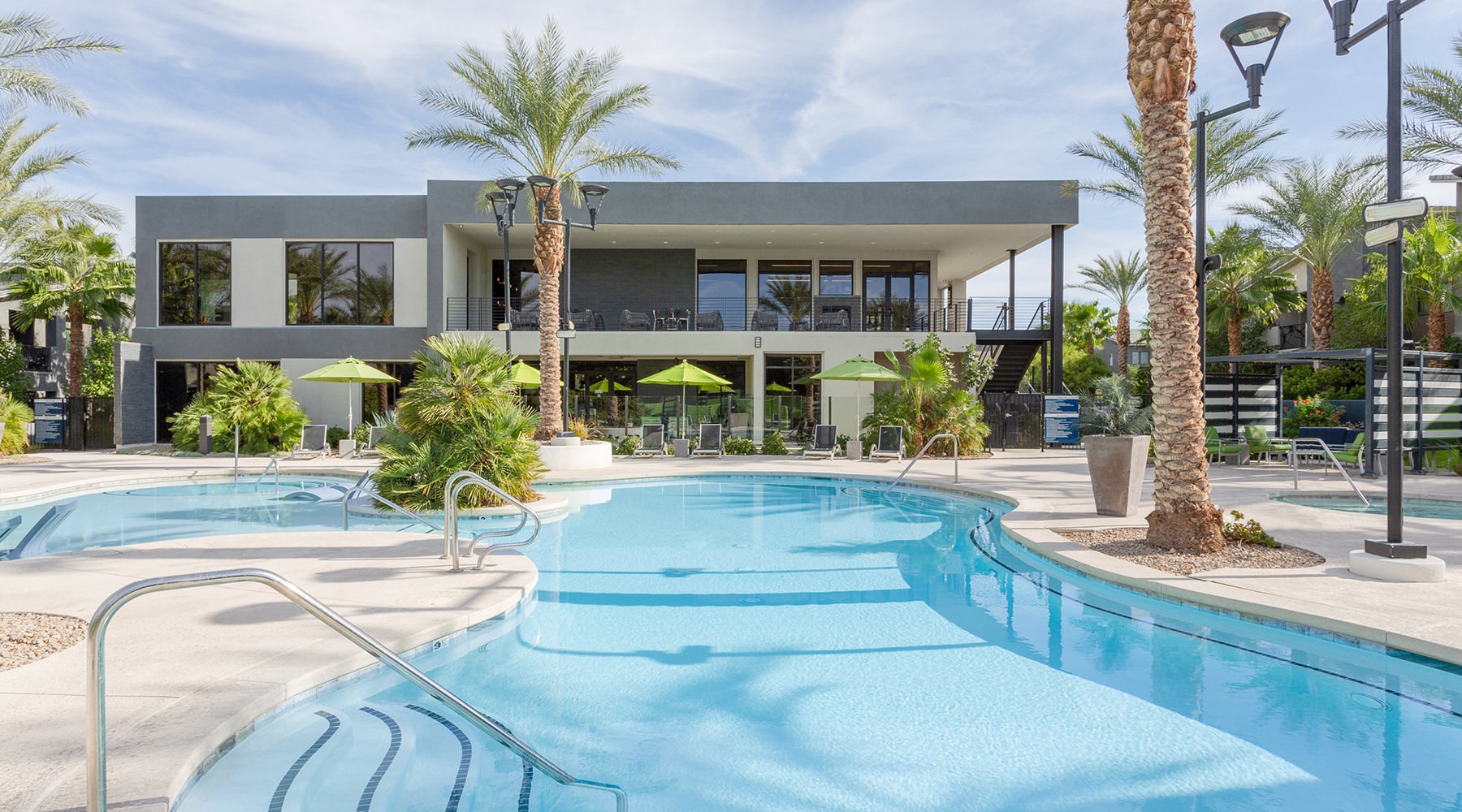 Resort-style swimming pool with lounge seating